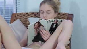 Beautiful Blonde Girl Playing with her Magazine